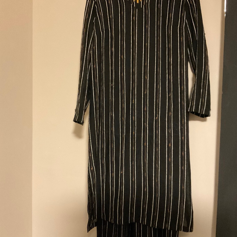 Two piece set..pants and tunic. Approximate size medium